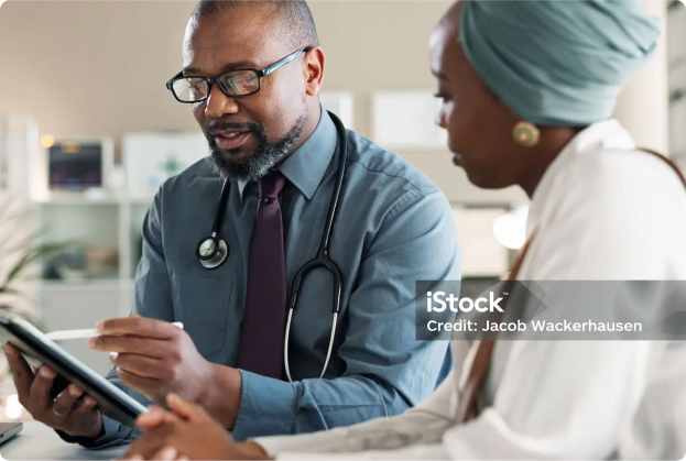 Total Health Care - hero image of doctor helping lady
